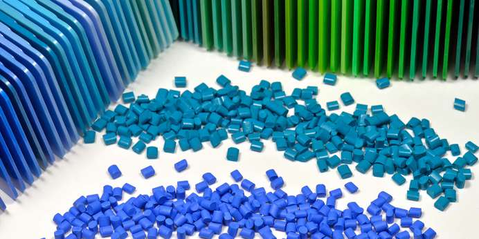 blue and teal pellets utilized to create opaque plastic sheets