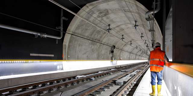 Construction worker inside a tunnel wearing high-visibilty safety clothing