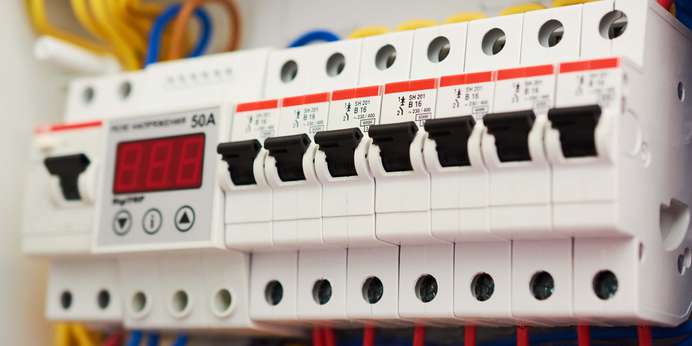 White plastic enclosures with red, yellow, and blue wires feeding into them