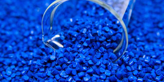 A large pile of blue recycled pellets