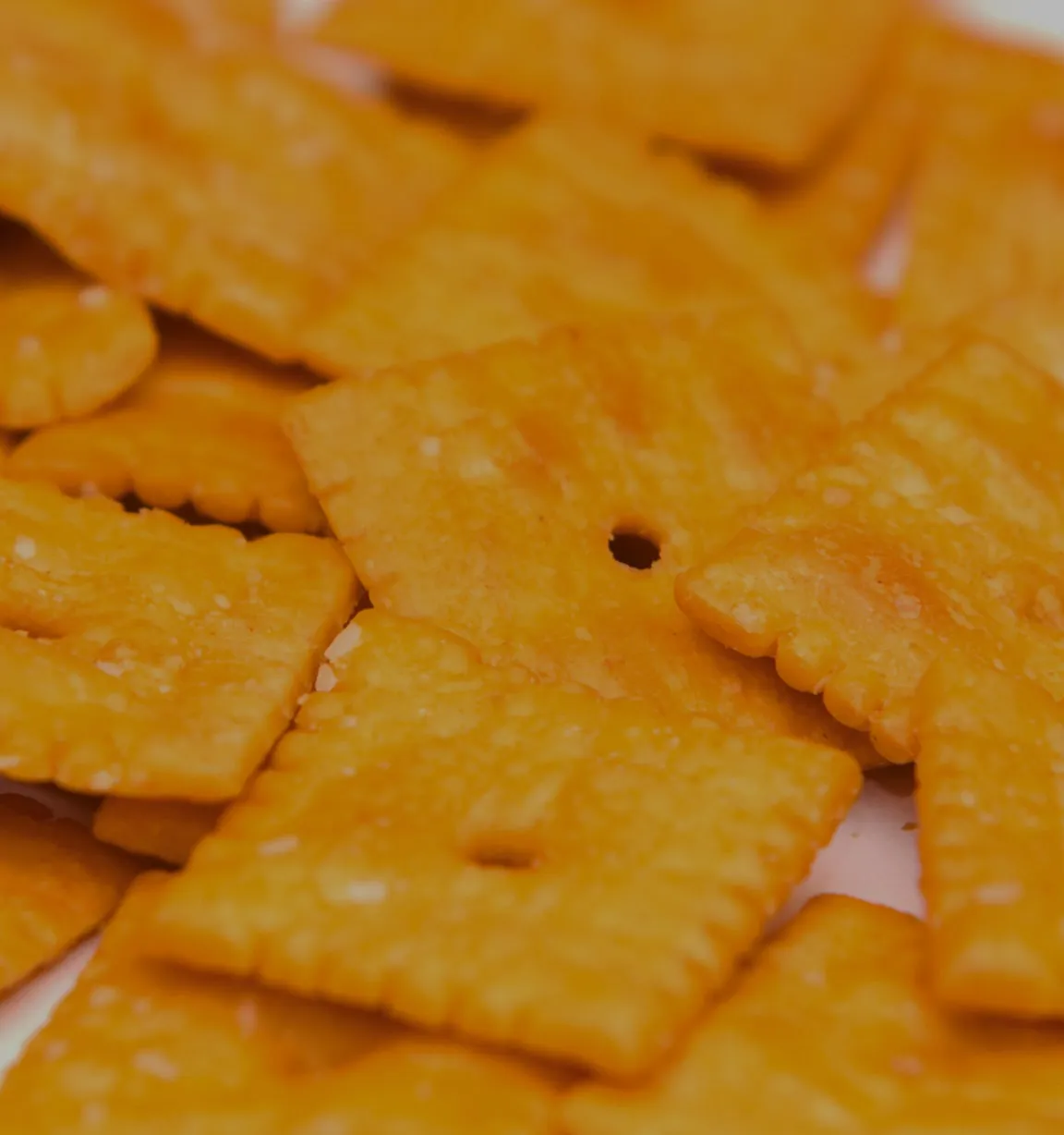 Orange square-shaped cheese crackers